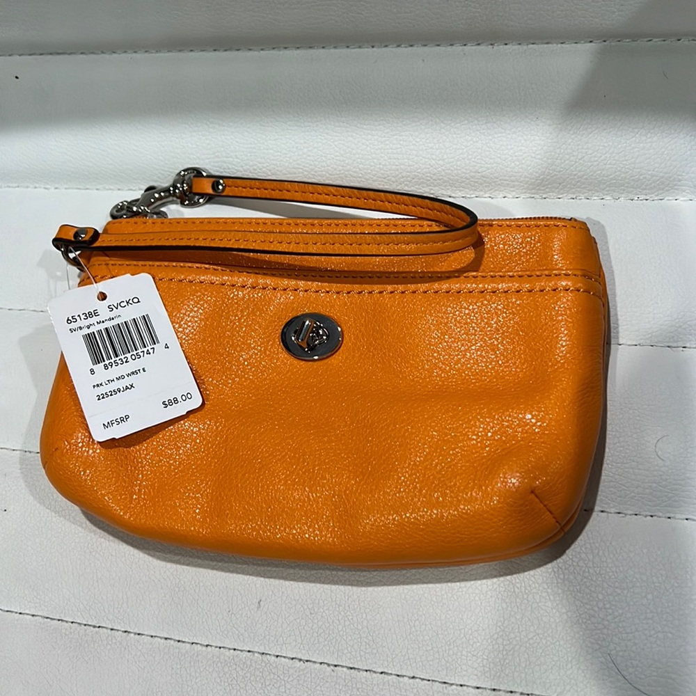 Coach orange wristlet ~5x8inch